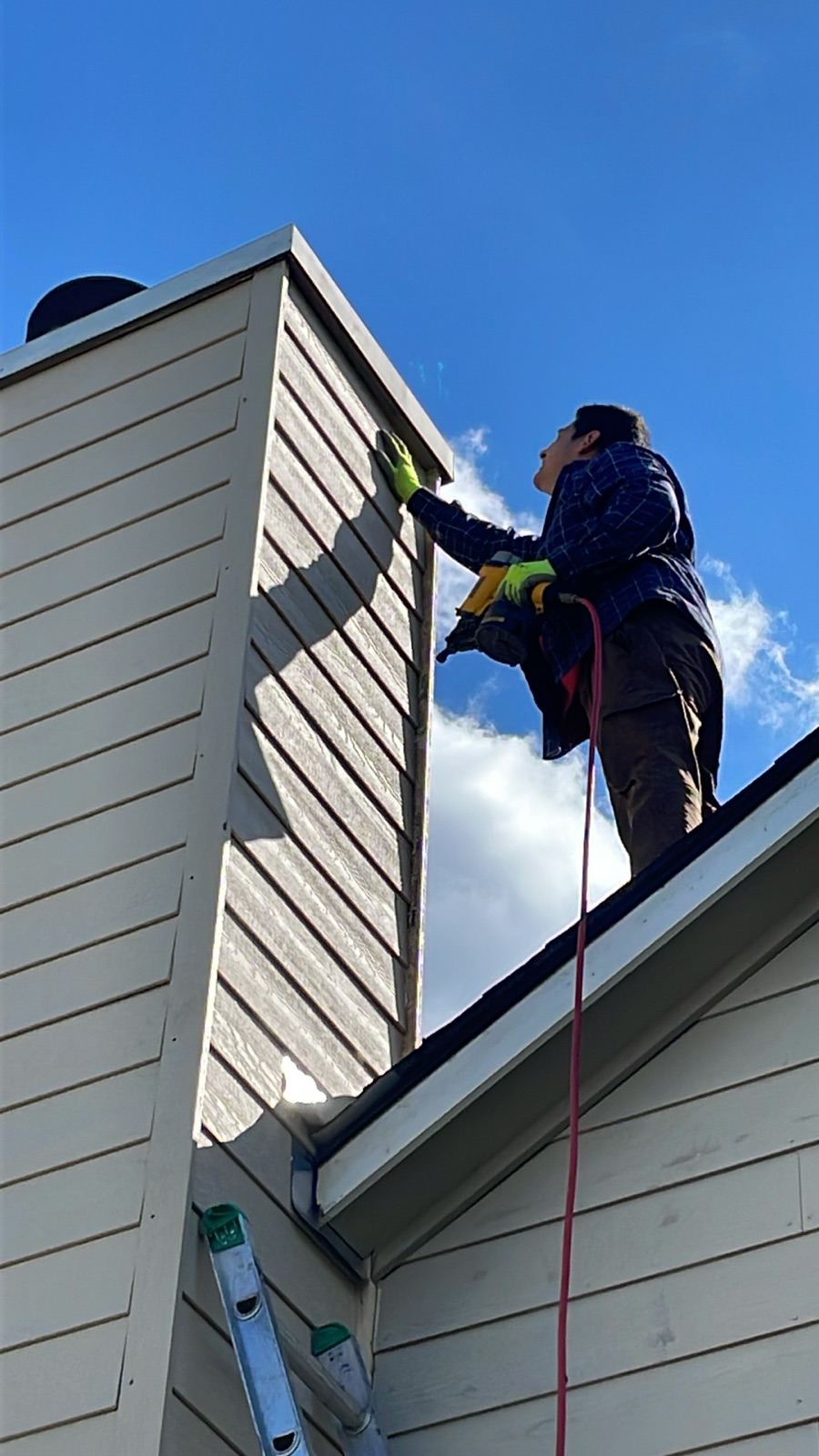 Repaired chimney siding on a residential home